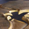 Dekorativer Couchtisch GINKGO 95cm gold schwarz handmade Metall