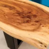 Massiver Couchtisch LIQUID 110cm braun Akazienholz Baumkante schwarz Eisen blau
